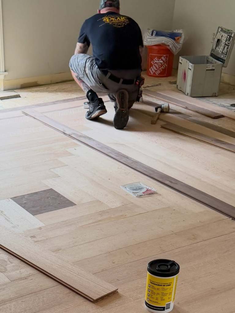Installed 6 inch rift quarter sawn red oak with a walnut border from @hickmanwoods . Glue and 4