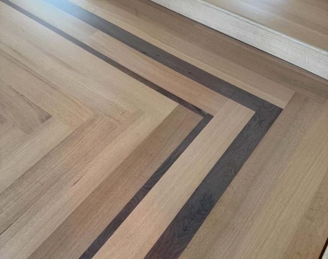 Installed 6 inch rift quarter sawn red oak with a walnut border from @hickmanwoods . Glue and 6