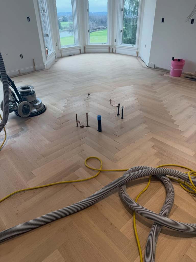 White oak rift and quarter sawn solid herringbone from @hickmanwoods. Stained @bonapro.us natu 3