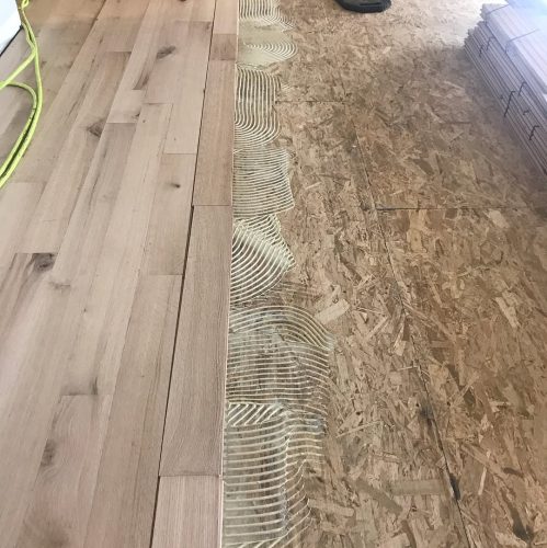 Before and after photos. This was a new install red oak 5 inch rift and quartered. Then we sand 3