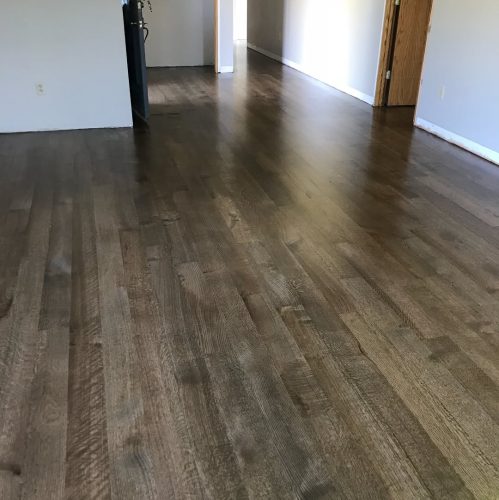 Before and after photos. This was a new install red oak 5 inch rift and quartered. Then we sand 7