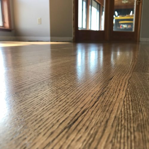 Before and after photos. This was a new install red oak 5 inch rift and quartered. Then we sand 8