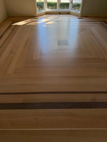 Installed 6 inch rift quarter sawn red oak with a walnut border from @hickmanwoods . Glue and 11